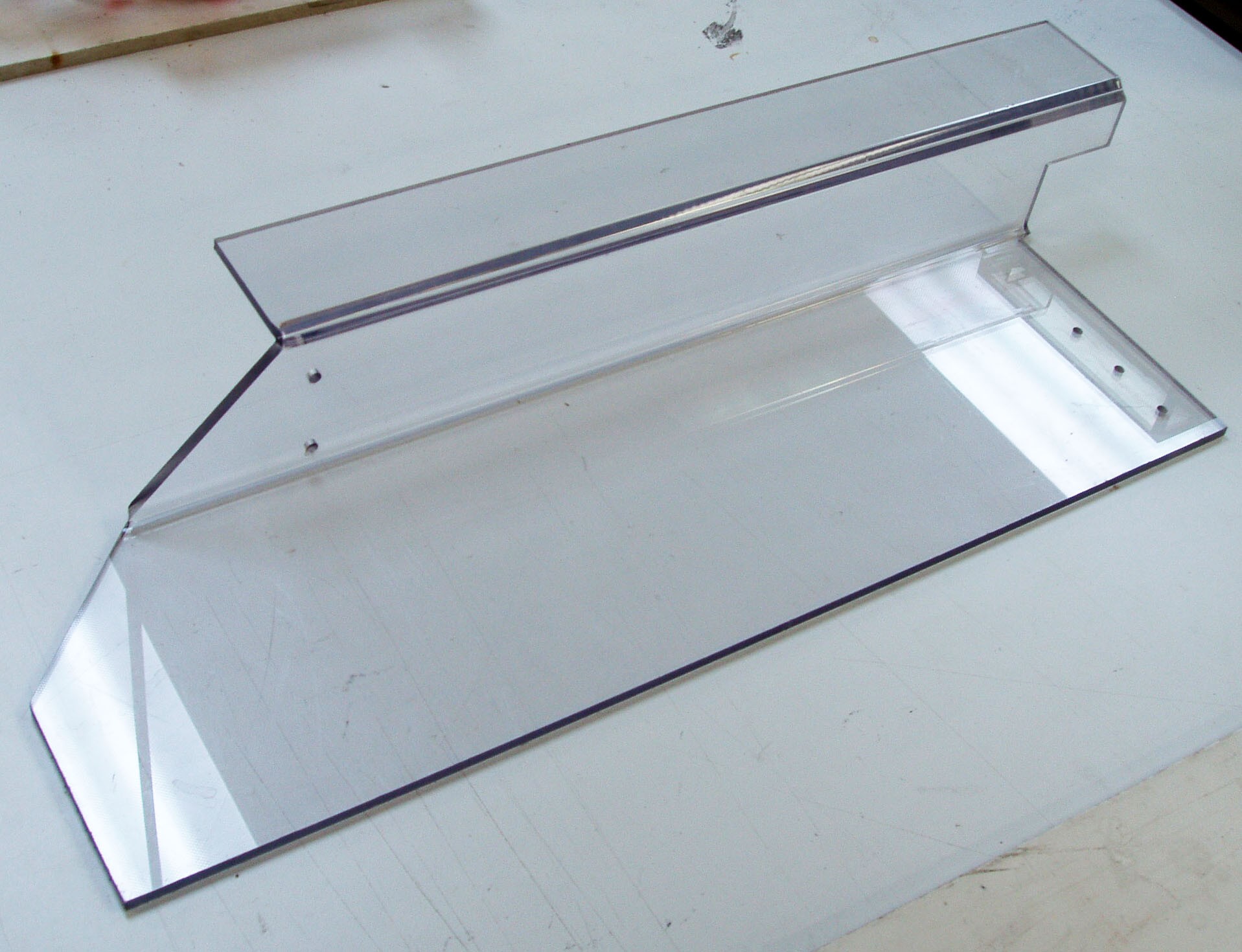 A plexiglass or acrylic plastic sheet